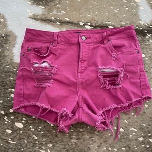 Distressed pink jean shorts